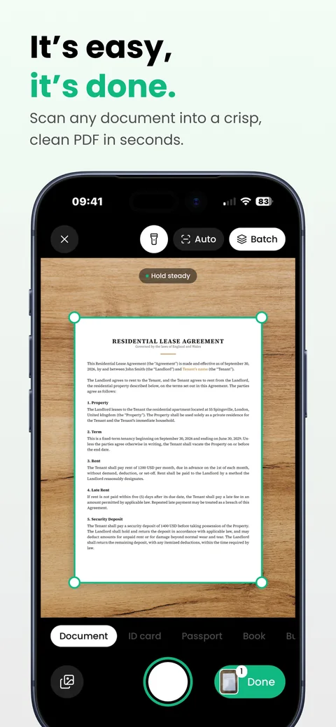 App Store screenshot: It's easy, it's done. The scanner finding the edges of a lease agreement on a wooden desk.
